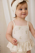Combinaison-short en coton biologique blanc à imprimé floral vintage avec ourlet péplum et fermeture à bouton-pression