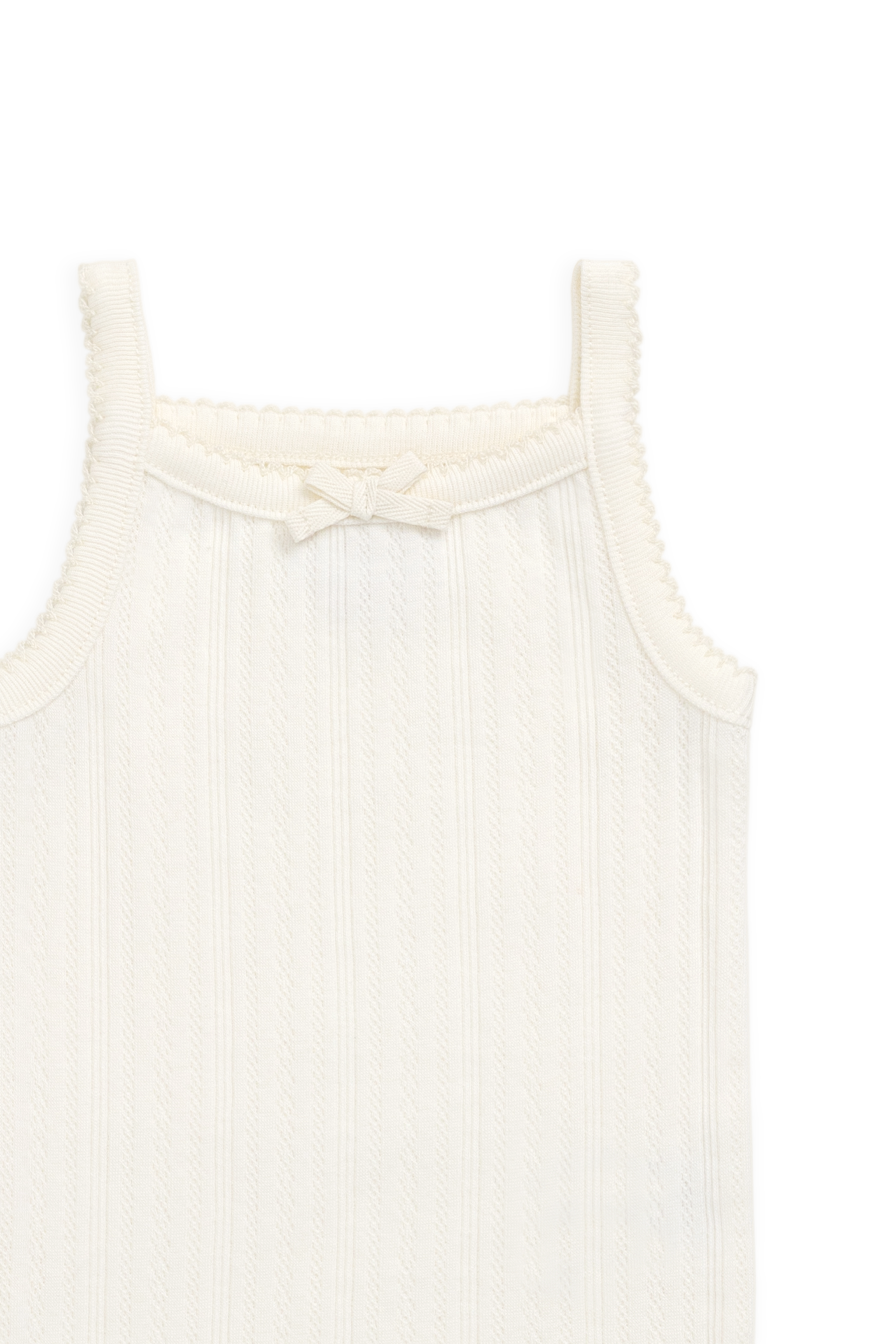 Grenouillère délicate en maille interlock ajourée de coton biologique, coloris parchemin, avec nœud.