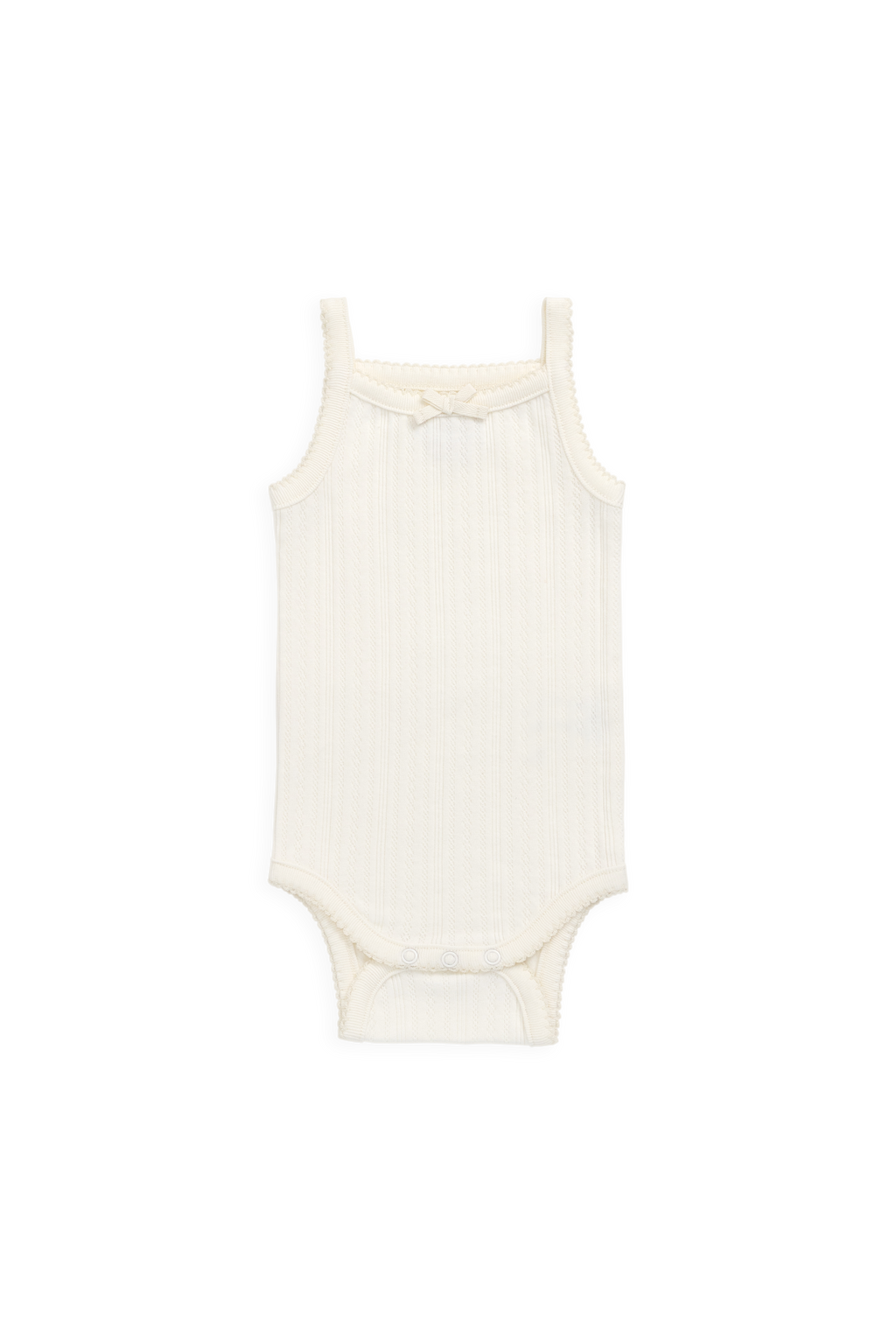 Grenouillère délicate en maille interlock ajourée de coton biologique, coloris parchemin, avec nœud.