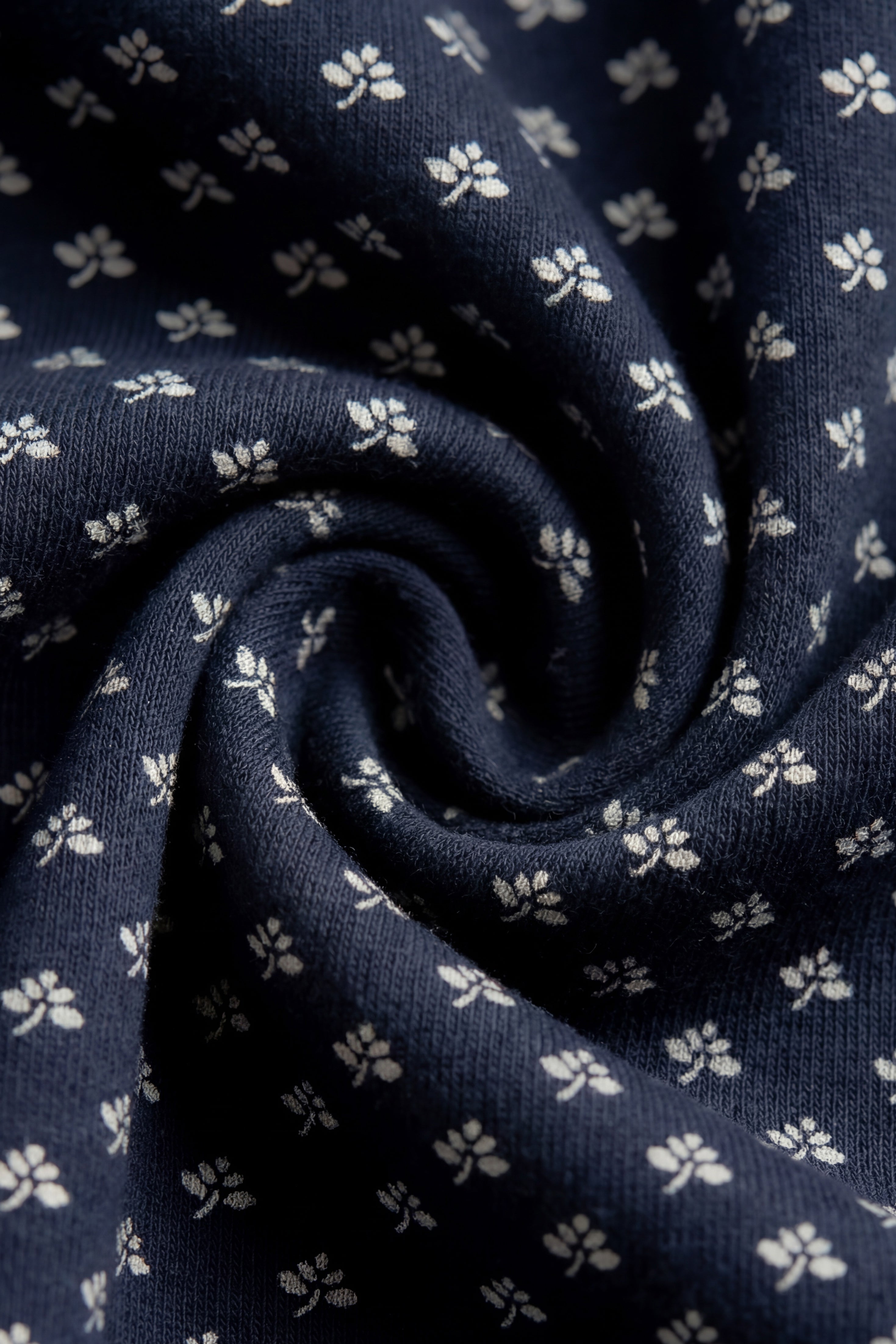 Combinaison décontractée en coton biologique bleu marine à motif floral avec fermeture éclair sur le devant et poignets côtelés