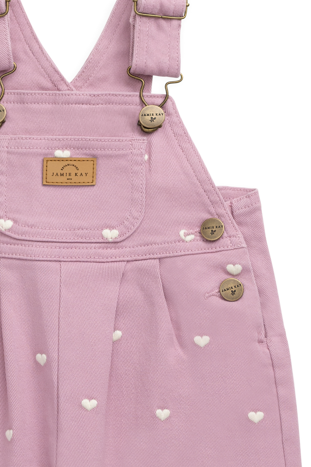 Salopette en coton et élasthanne rose vif avec bretelles réglables et poche kangouruli