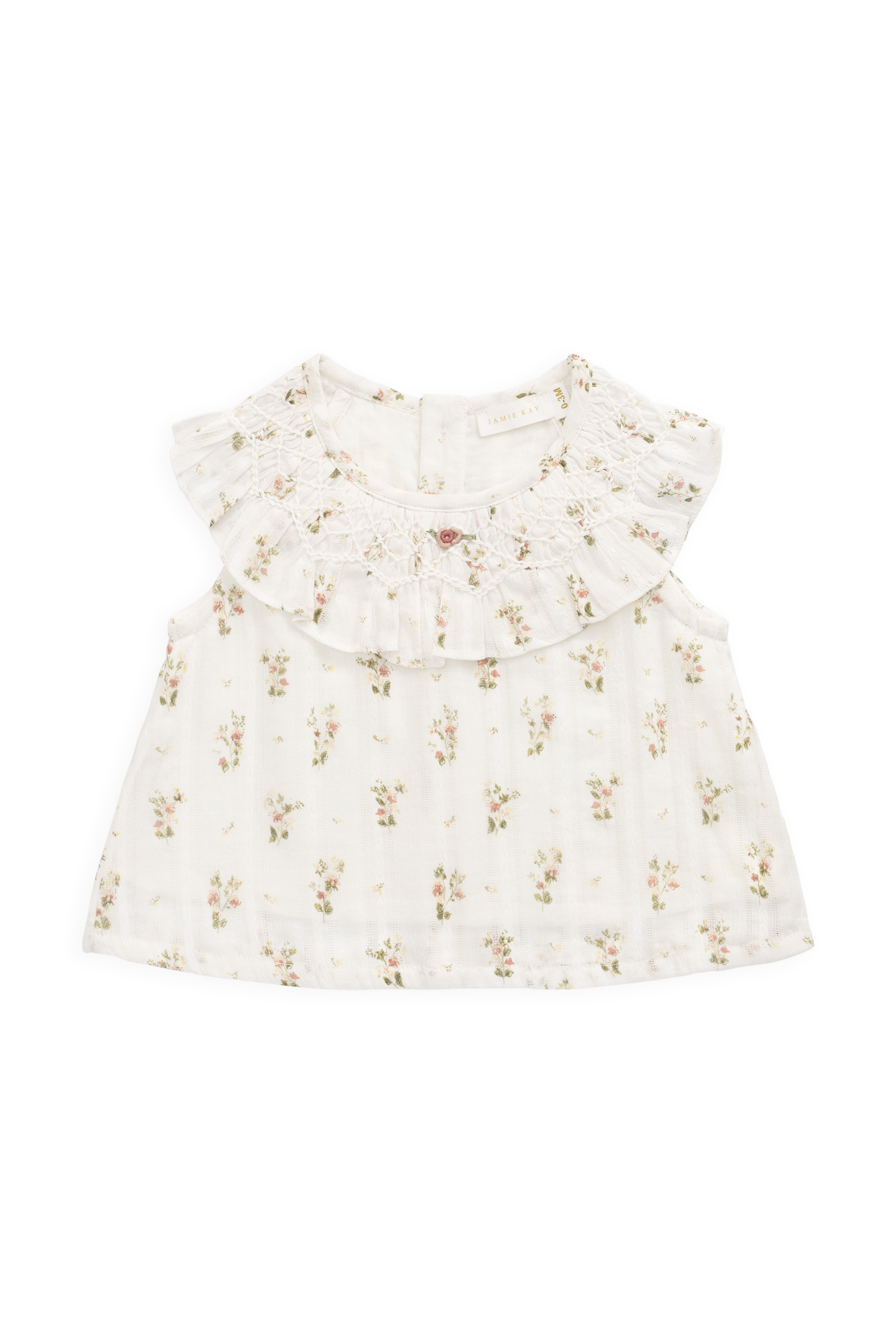 Haut en coton biologique blanc à imprimé floral vintage avec encolure à volants et manches courtes.