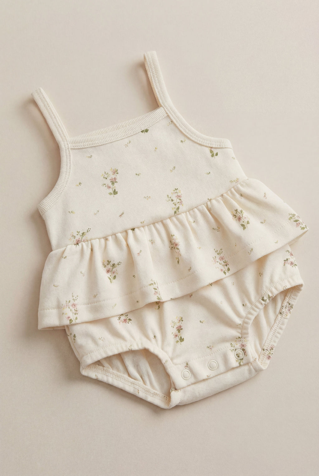Combinaison-short en coton biologique blanc à imprimé floral vintage avec ourlet péplum et fermeture à bouton-pression